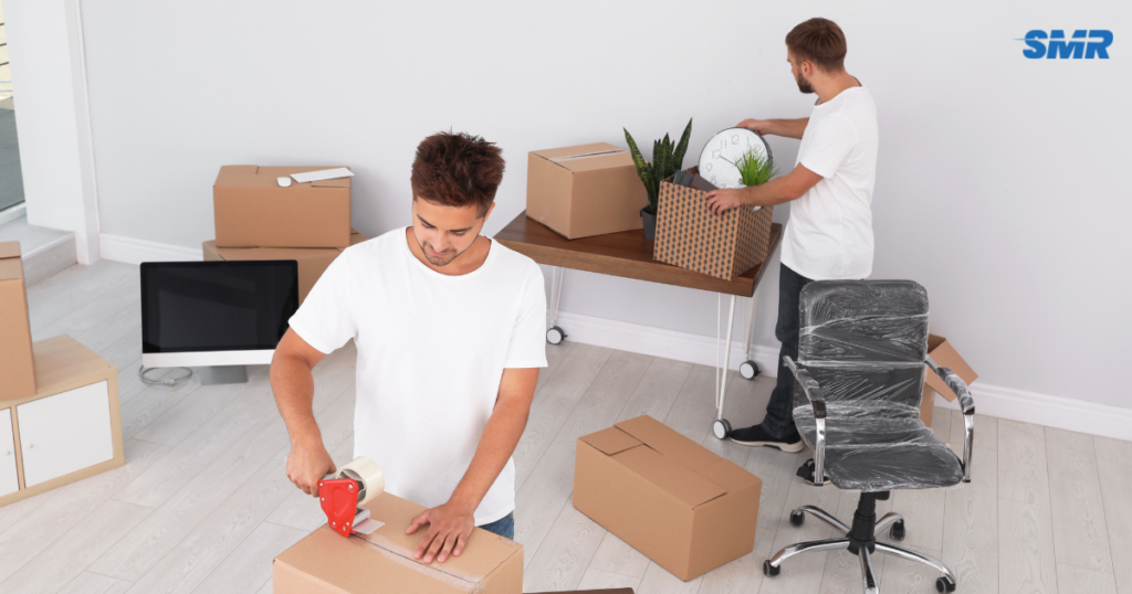 Man and Van Gospel Oak movers loading furniture and moving boxes into a removals van