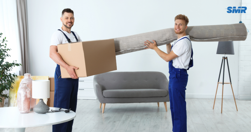 Flat removals Greenford UB6 movers transporting furniture into an apartment building