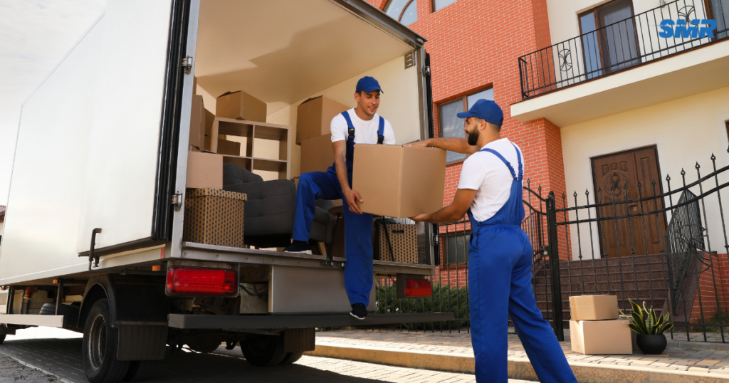 Man and Van Hackney movers loading furniture and moving boxes into a removals van