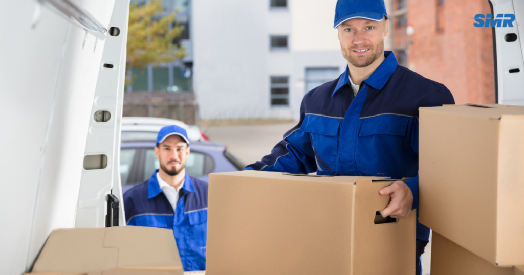 Man and Van Gunnersbury Removals movers loading furniture and moving boxes into a removals van
