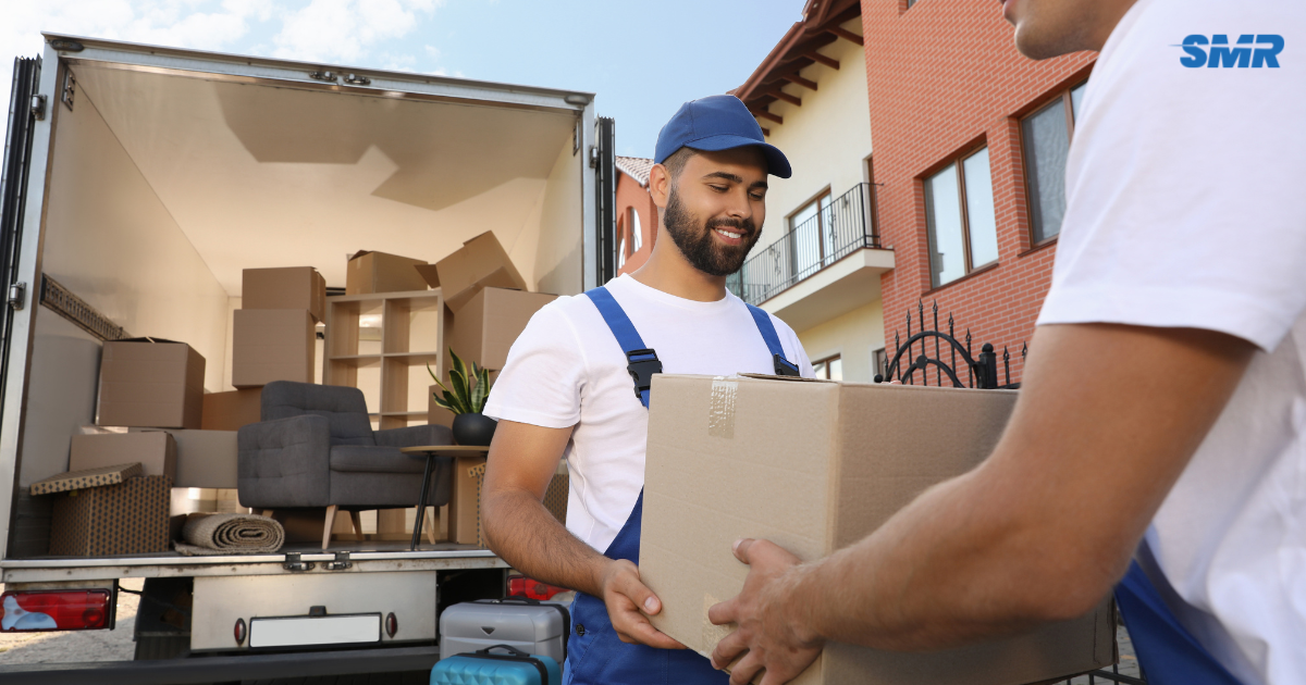Professional man and van Hayes movers loading furniture