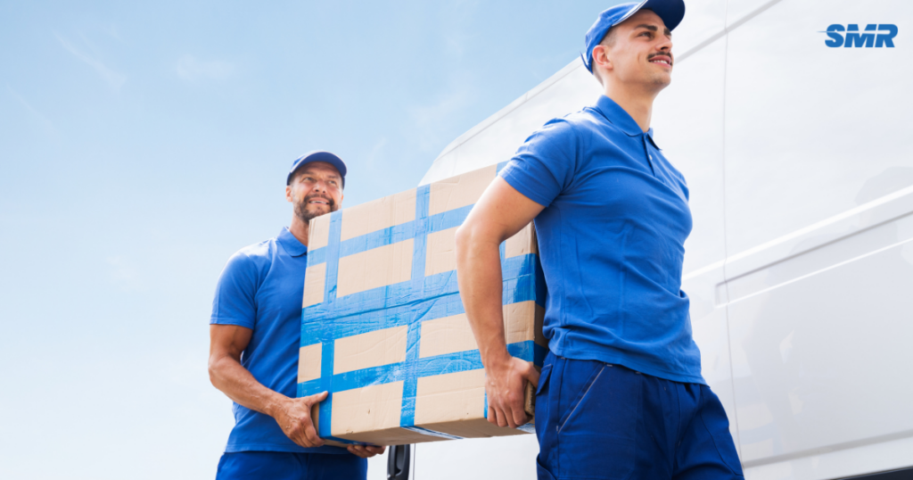 Team moving furniture and boxes into an Acton home