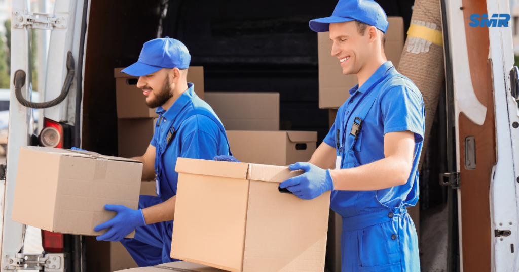 Cheap man and van Barking movers loading wrapped furniture and boxes into a removal van
