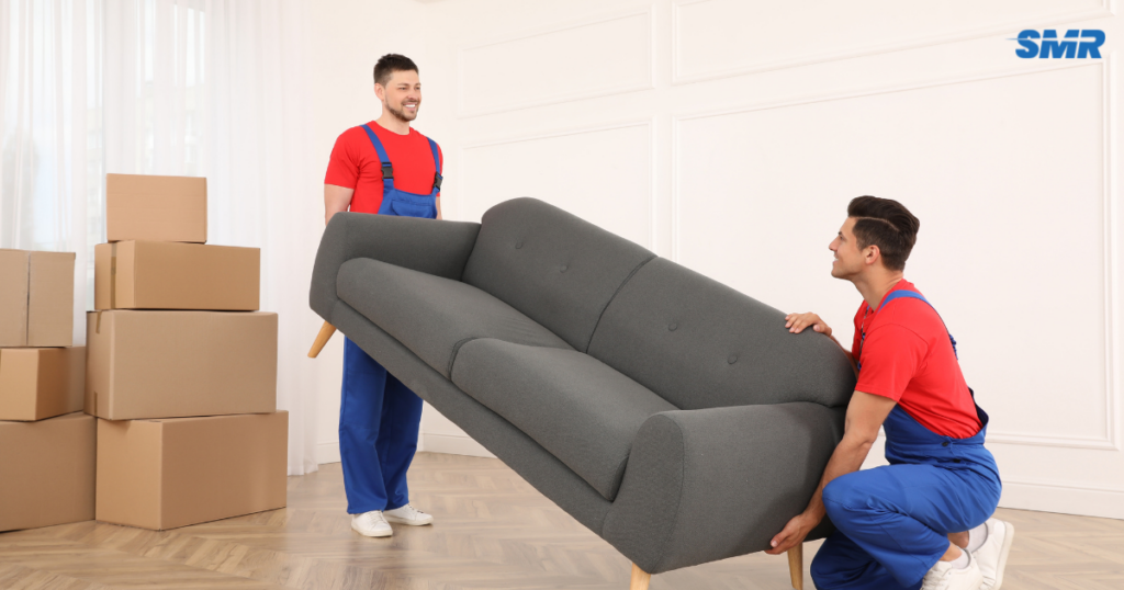 2 man and van Battersea movers carrying wrapped furniture for a local removal job