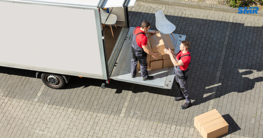 Man and Van Eltham SE9 movers loading boxes and furniture into a removals van