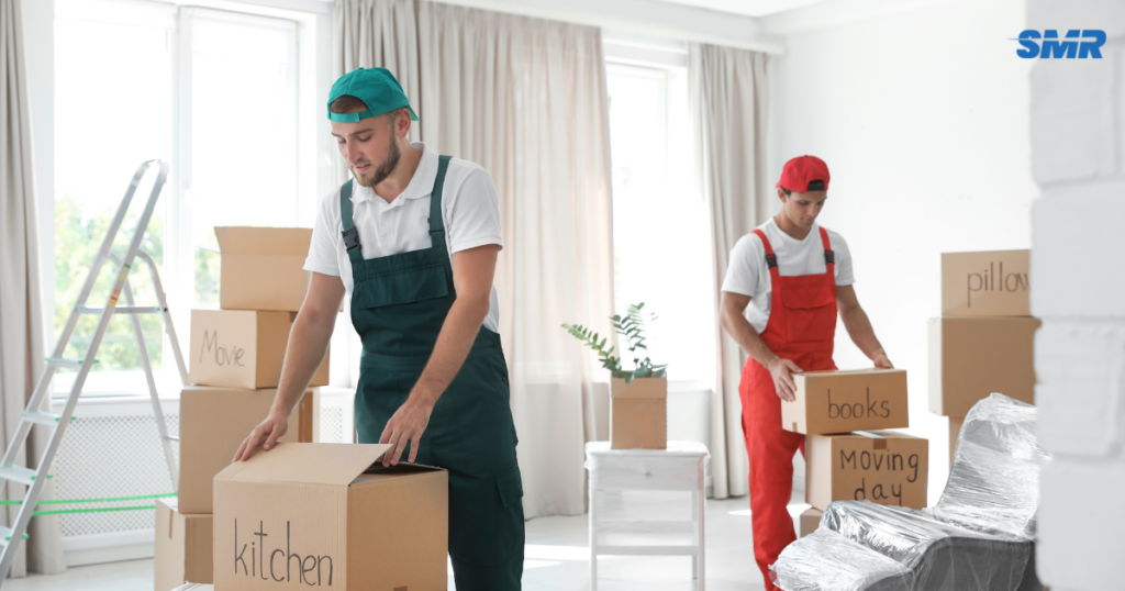 Man and Van Finsbury movers loading furniture and moving boxes into a removals van