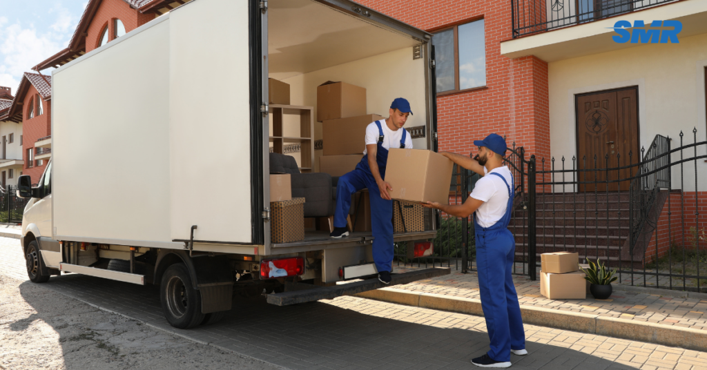 Man and van in W9 London street, local removals team loading a van