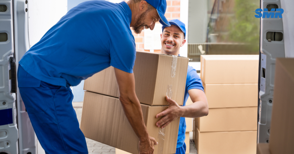 Movers closing van with loaded items in SW8