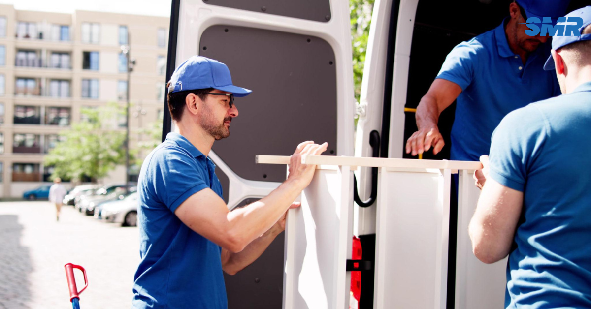 Professional Homerton movers loading furniture into a van