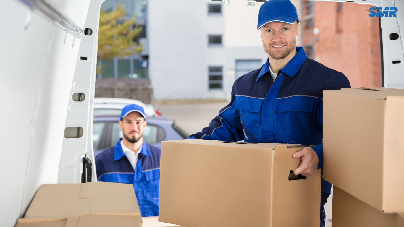 Professional man and van Harrow movers loading furniture into removal van