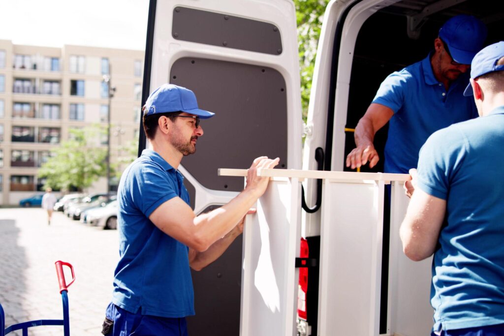 Man and Van Park Royal team loading moving boxes into a removal van
