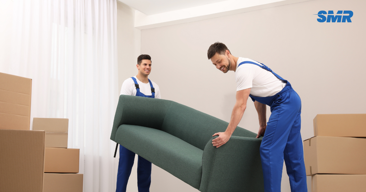 Professional man and van Hammersmith movers loading furniture into removal van